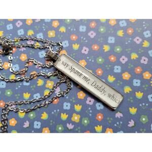 Spank Me pendant necklace made with Husband Material book pages